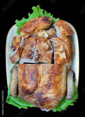 Baked chicken stuffed with minced meat with fruits and vegetables. photo