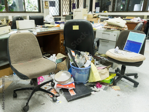 Dirty, messy and abandoned office, poor light