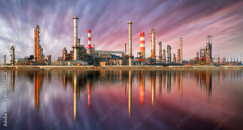 Oil Refinery at sunset with reflection Oil Refinery at sunset with reflection