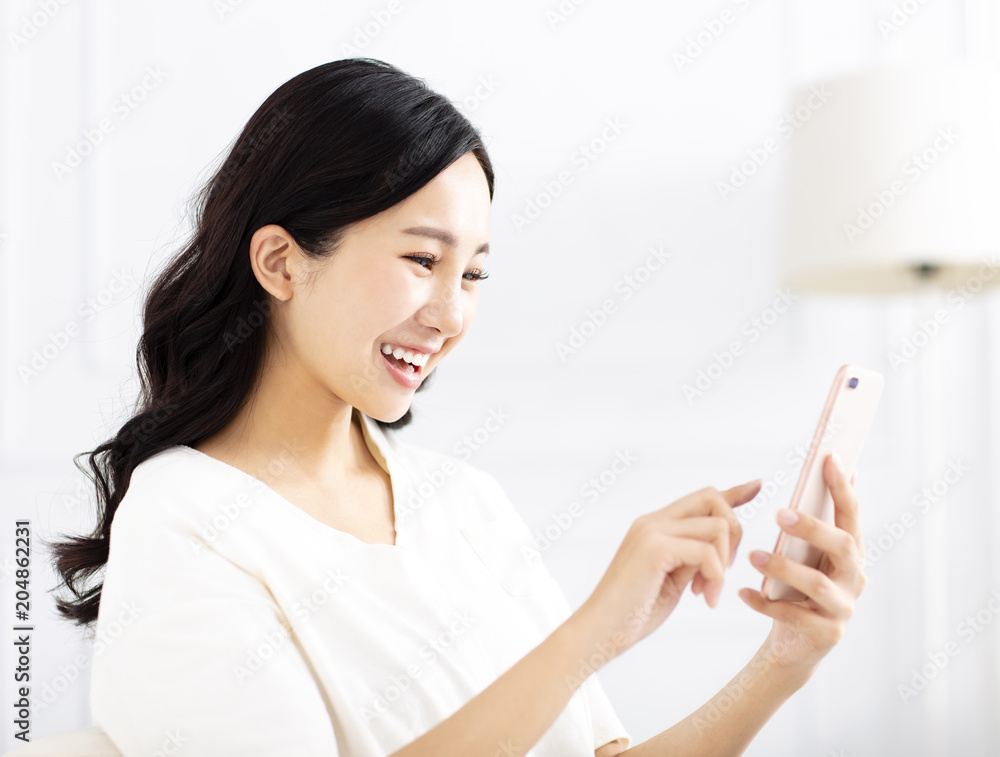 beautiful young woman watching the mobile phone beautiful young woman watching the mobile phone