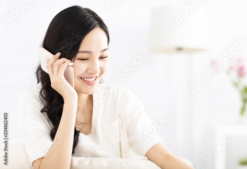 beautiful young woman talking on the phone