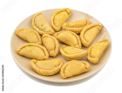 Gujiya or Gujia is a indian sweet dumpling made with suji, Maida or wheat flour and stuffed with khoya. It is common in North India, particularly in Bihar, Uttar Pradesh, Madhya Pradesh or Rajasthan