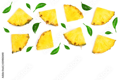 Sliced pineapple decorated with green leaves isolated on white background with copy space for your text. Top view