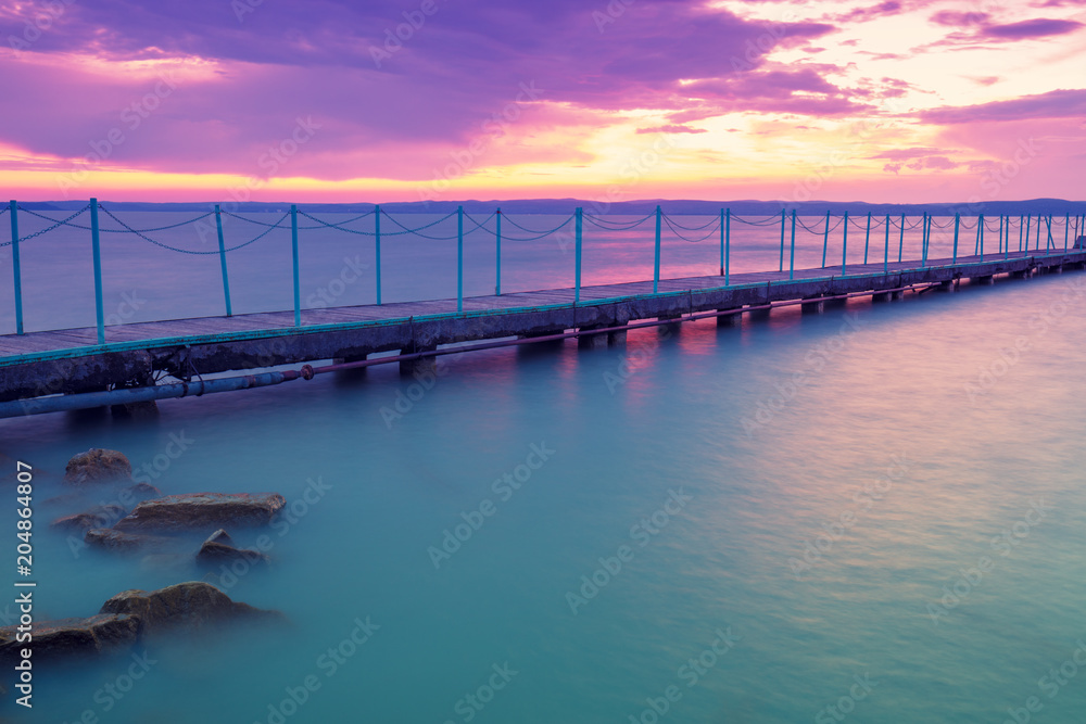 Fototapeta premium Pier on the lake Balaton at sunset. Hungary