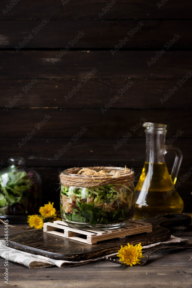 Salad from sprouts of sprouted soy and dandelion leaves in a jar Salad from sprouts of sprouted soy and dandelion leaves in a jar