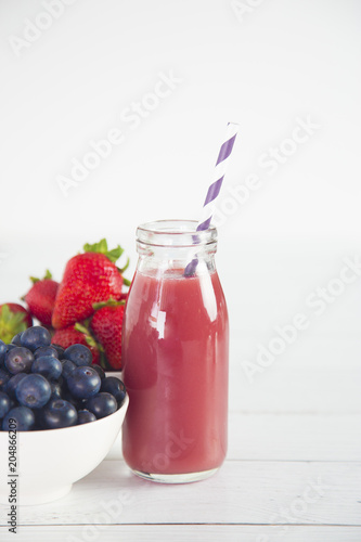 Berry Fruit Smoothy on a White Wood Table