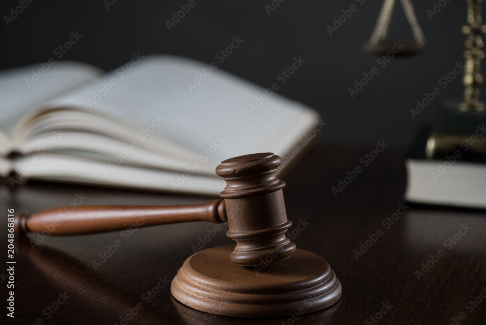 Law theme, mallet of the judge, wooden desk, books Law theme, mallet of the judge, wooden desk, books