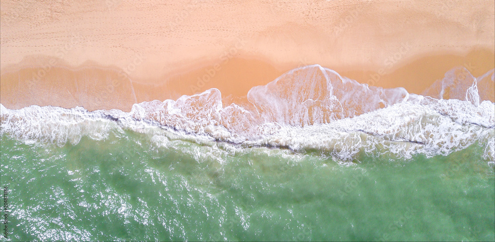 Aerial view of tropical sandy beach and ocean. Copy space