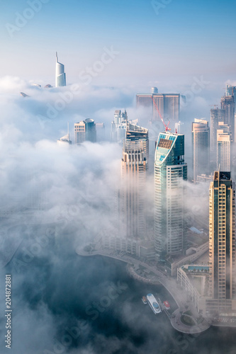 Dubai skyline, aerial top view of the city in Dubai Marina on a foggy day