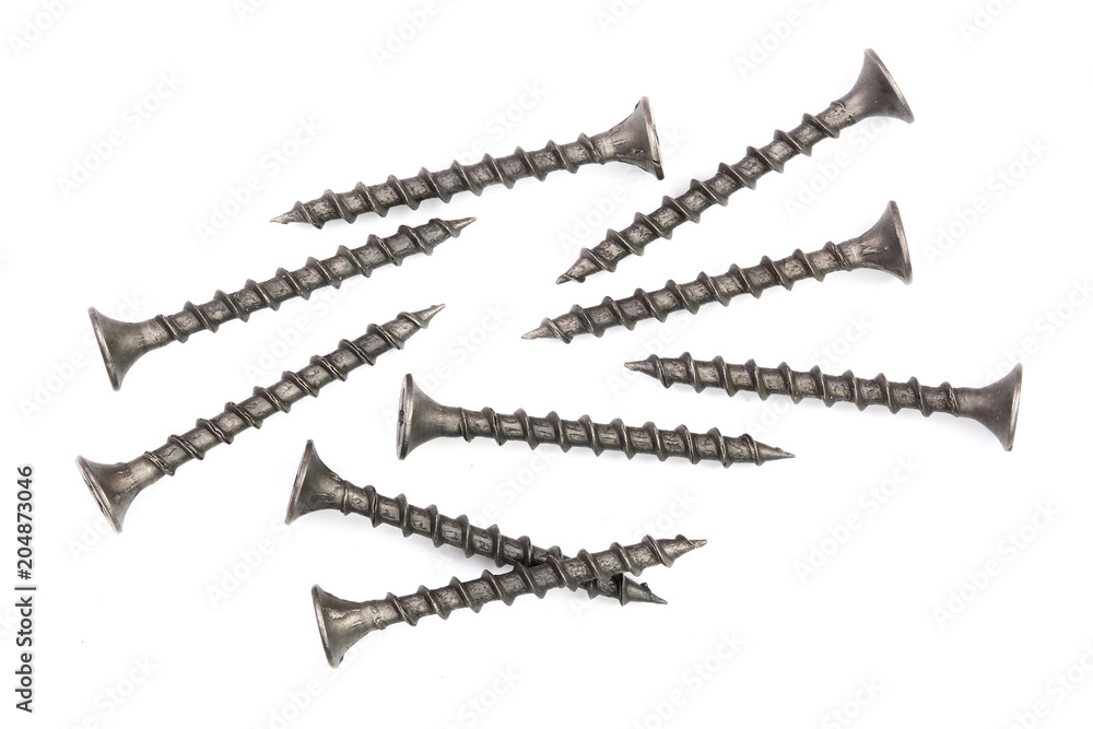 black screws isolated on white background closeup. Top view.