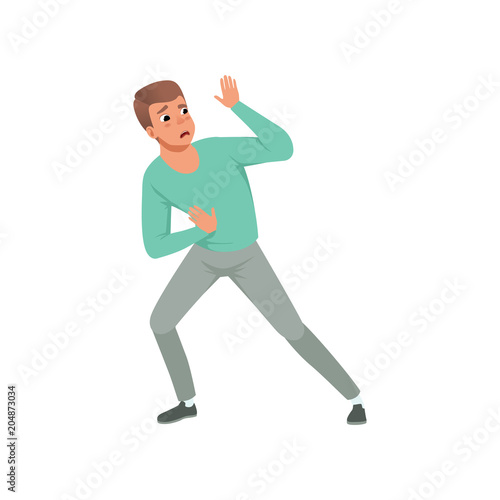 Young scared man standing in defensive pose and blocking his hands. Guy with frightened face expression. Flat vector design