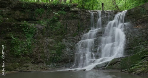 Timelaps of the waterfall in the wood, spring, 4k