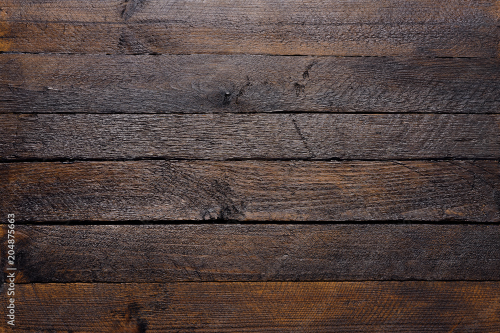 Fototapeta premium Wooden texture of dark wood planks top view