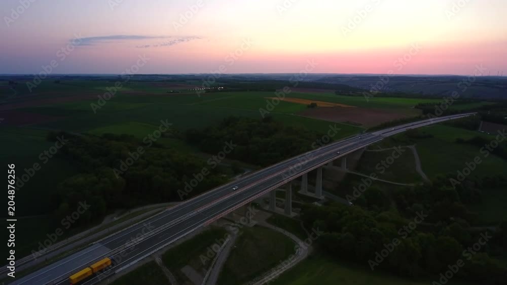 Aerial View of Traffic on a German motorway during sunset. Aerial View of Traffic on a German motorway during sunset.
