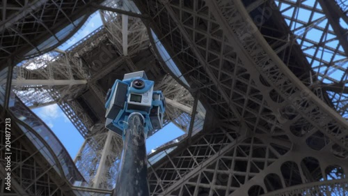 PARIS, FRANCE - SEPTEMBER 29, 2017: Low angle shot of seven GoPro cameras on tripod shooting 360 VR Video under the Eiffel Tower