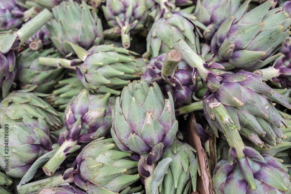 Fototapeta premium Big ripe artichokes for sale at local market