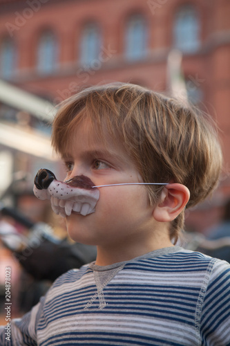 Little boy with puppy jaw disguise photo