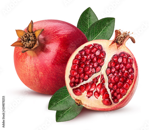 Ripe pomegranate fruit and one cut in half with leaf photo