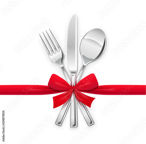 Fork, spoon, knife with red bow. Set of utensils for eating.