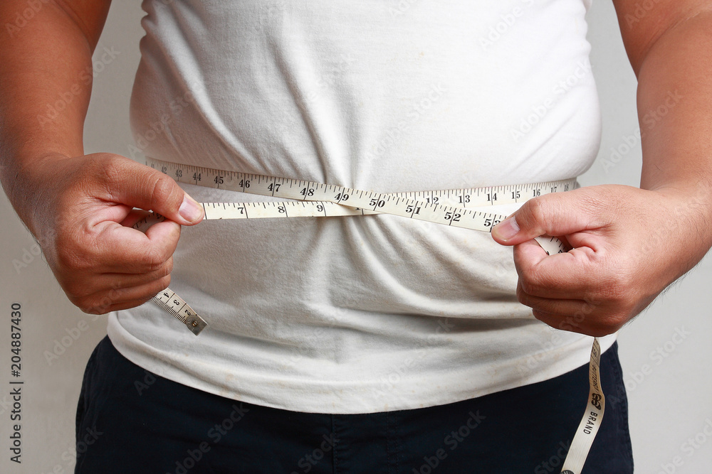 Fat people use waist measurement. Body check Stock Photo | Adobe Stock