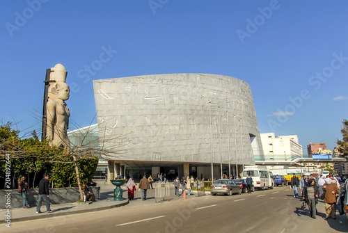 Alexandria, Egypt, 21 February 2018: Library of Alexandria, wall, statue, cars and people photo