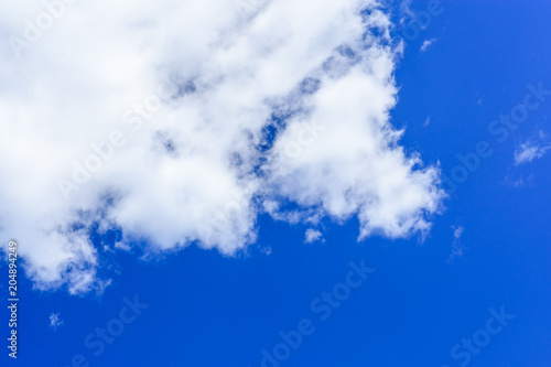 White fluffy clouds in a deep blue sky