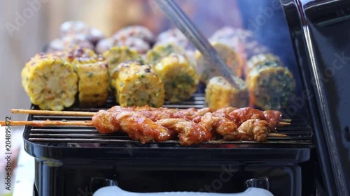 Vegan barbecue with seitan grill sticks, corn cobs and stuffed mushrooms 