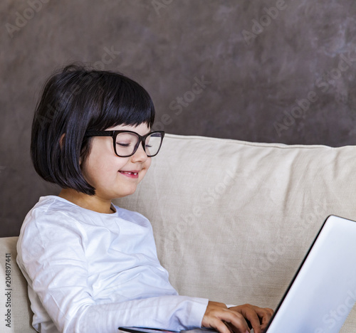 Cute little girl with laptop
