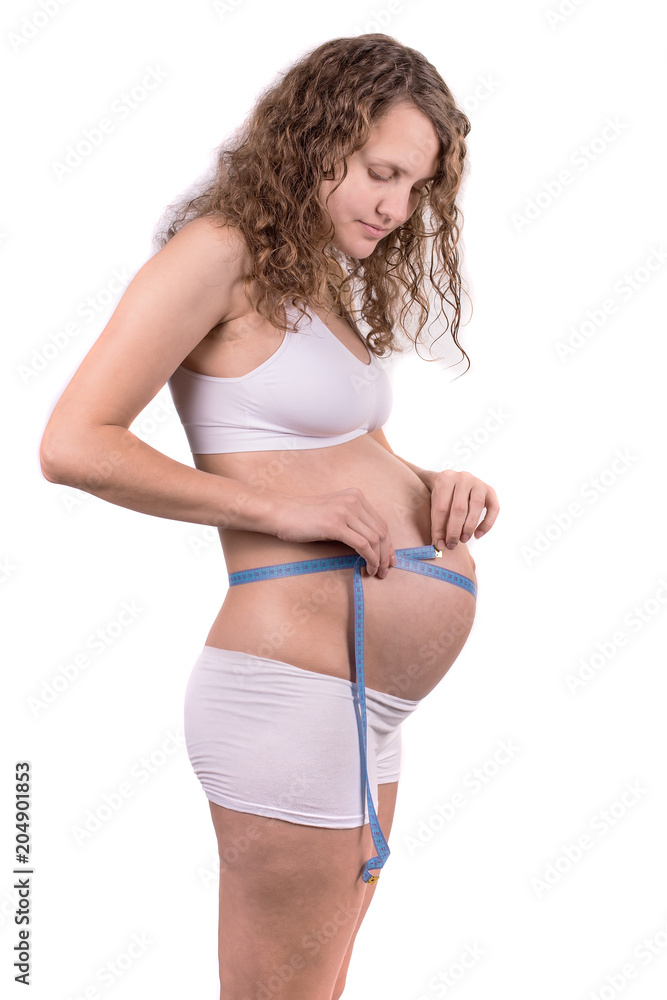 pregnant woman measuring her belly on white background pregnant woman measuring her belly on white background