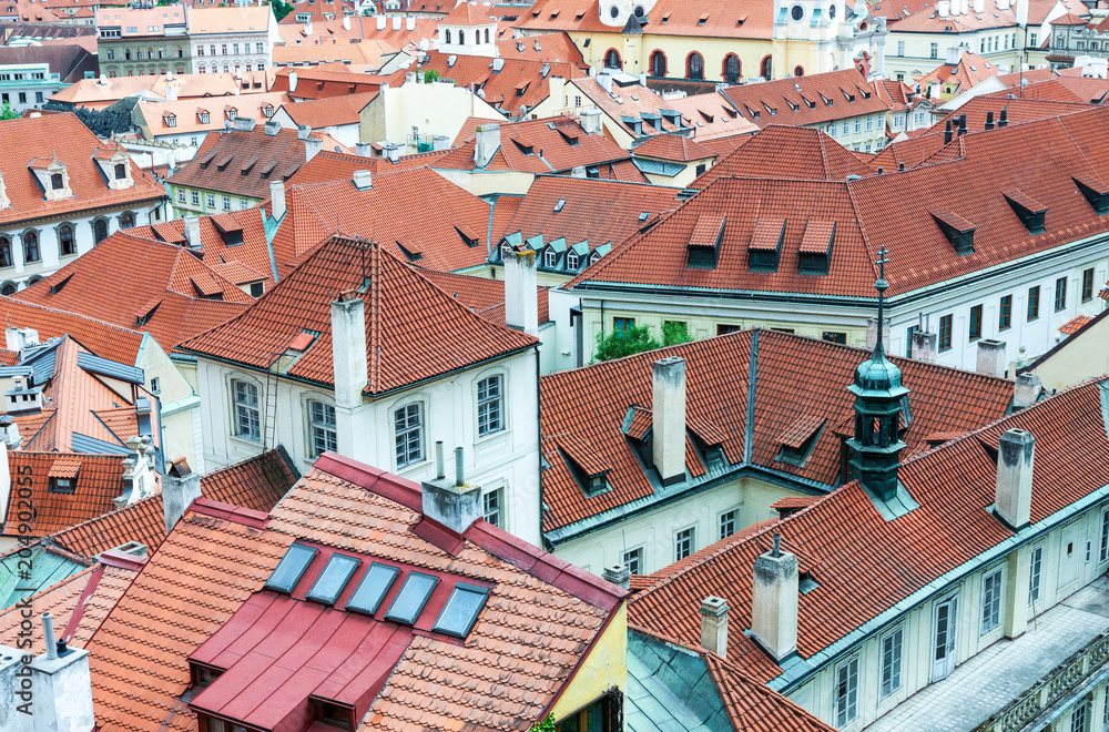 Red tiled roofs of historic architecture buildings in the old town of Prague, Czech Republic