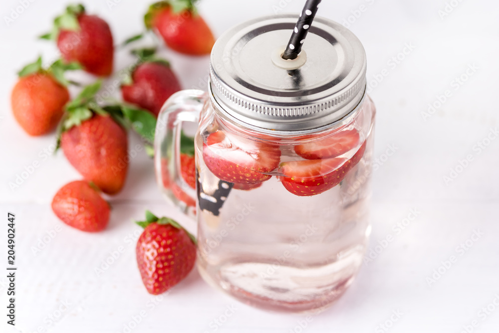 Mug of Delicious Refreshing Drink of Strawberry on White Wooden Background Infused Detox Water Above Mug of Delicious Refreshing Drink of Strawberry on White Wooden Background Infused Detox Water Above