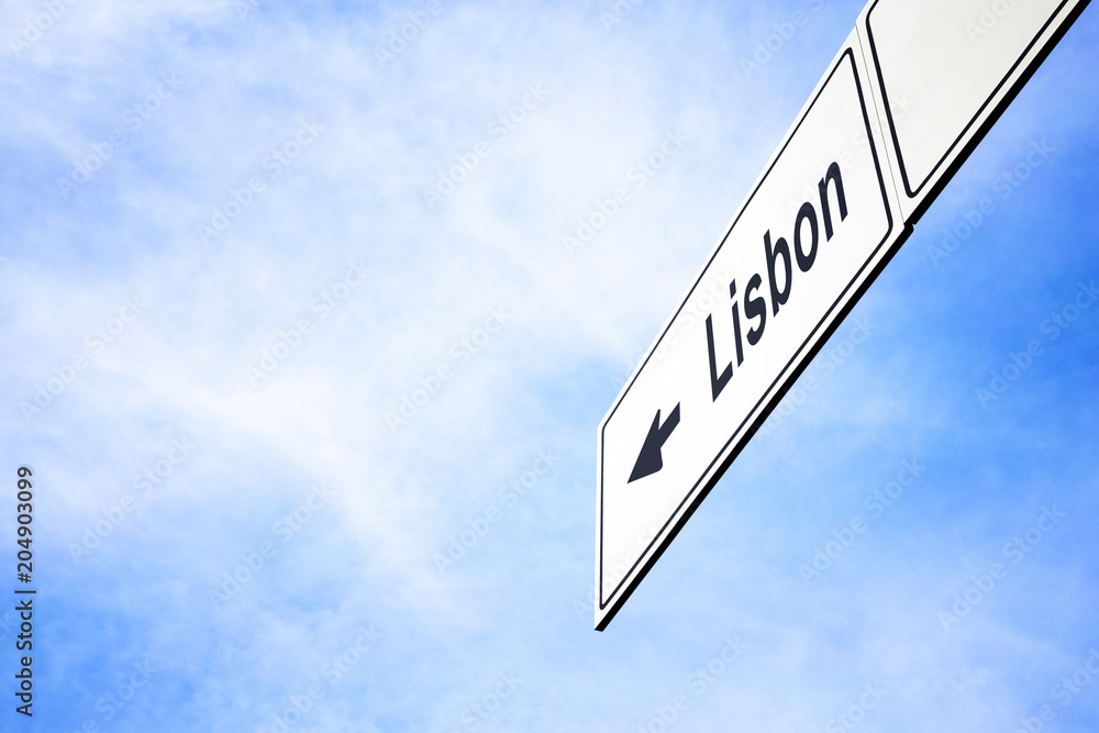 Signboard pointing towards Lisbon