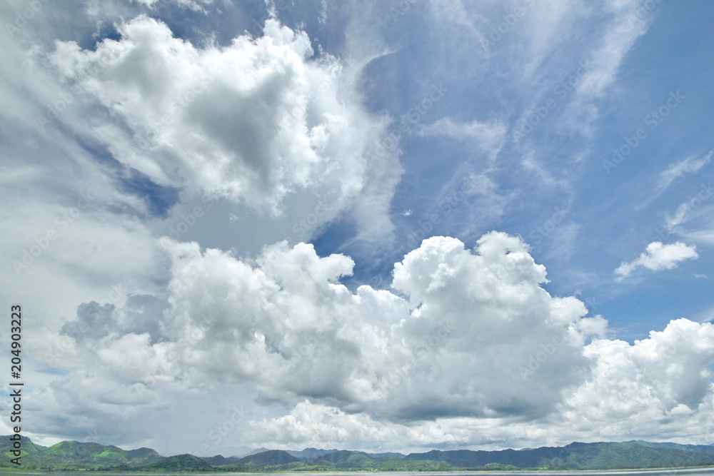 The Islands and mountains on reservior in dam. On the day of clouds and cloud reflection in the beautiful water of KaengKrachan National Park. The Islands and mountains on reservior in dam. On the day of clouds and cloud reflection in the beautiful water of KaengKrachan National Park.