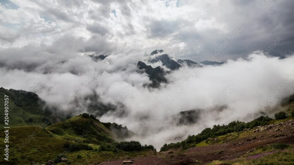 Clouds cover the mountain valley timelapse Clouds cover the mountain valley timelapse