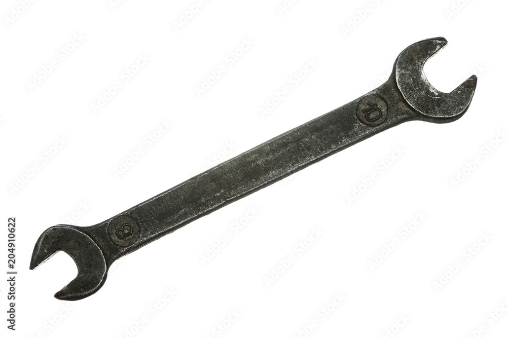 Old grungy wrench on white background. Isolated image of antiquare spanner. Old grungy wrench on white background. Isolated image of antiquare spanner.