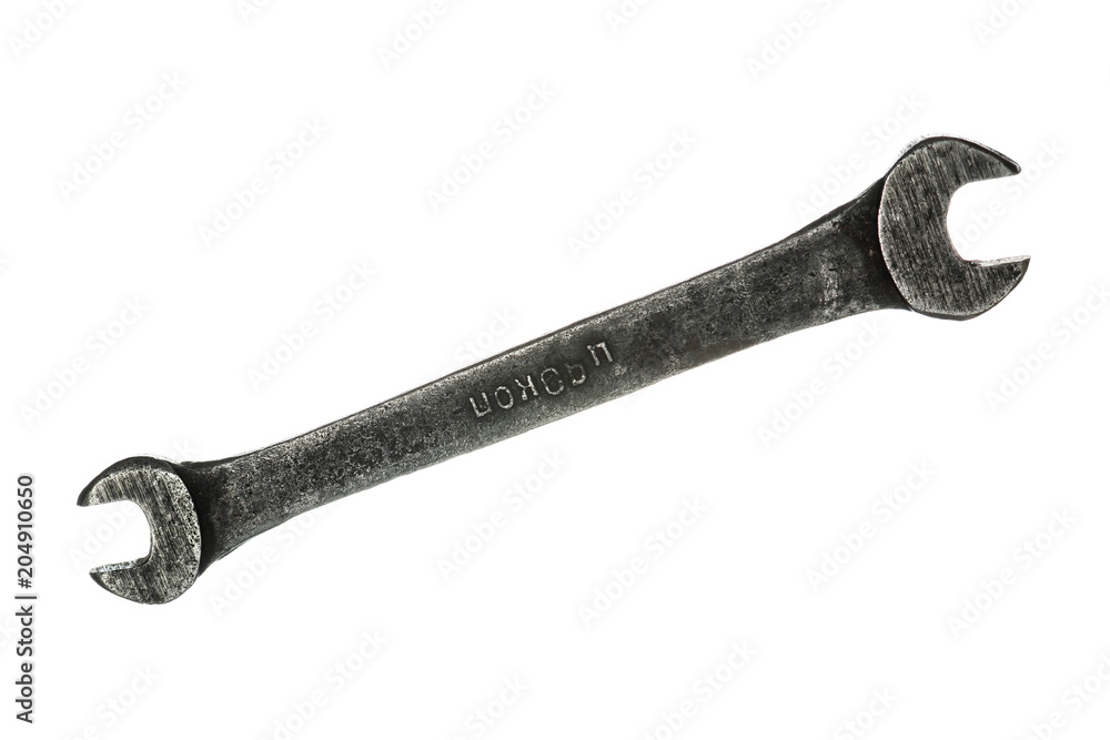 Old grungy wrench on white background. Isolated image of antiquare spanner. Old grungy wrench on white background. Isolated image of antiquare spanner.