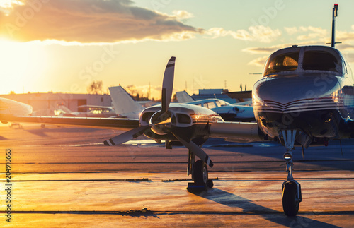 Small Aviation: Private Jet is Parked on a Tarmac in a Beautiful photo