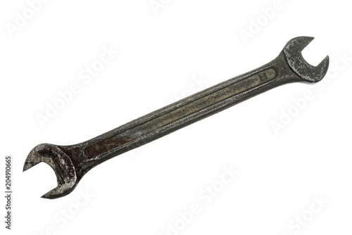 Old grungy wrench on white background. Isolated image of antiquare spanner.