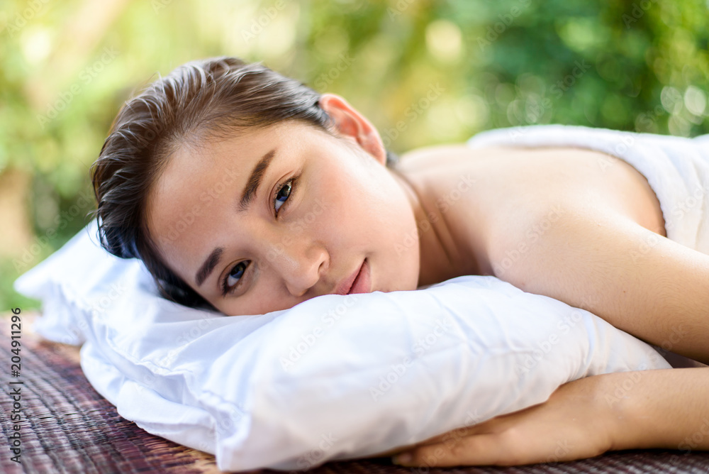 Obraz premium Young Asian woman feel relax after spa massage