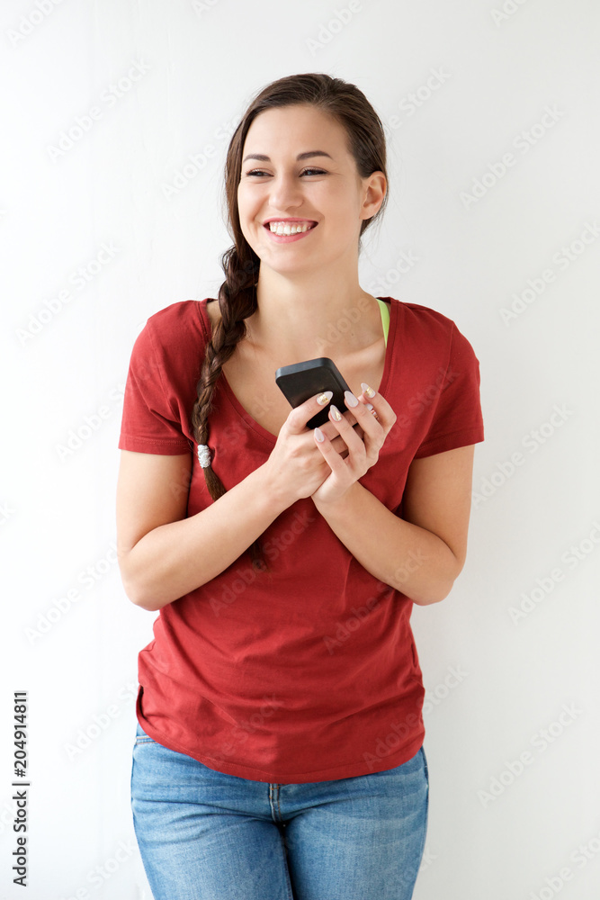 happy young woman holding mobile phone happy young woman holding mobile phone