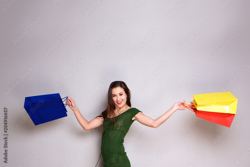 cheerful young woman laughing with shopping bags cheerful young woman laughing with shopping bags