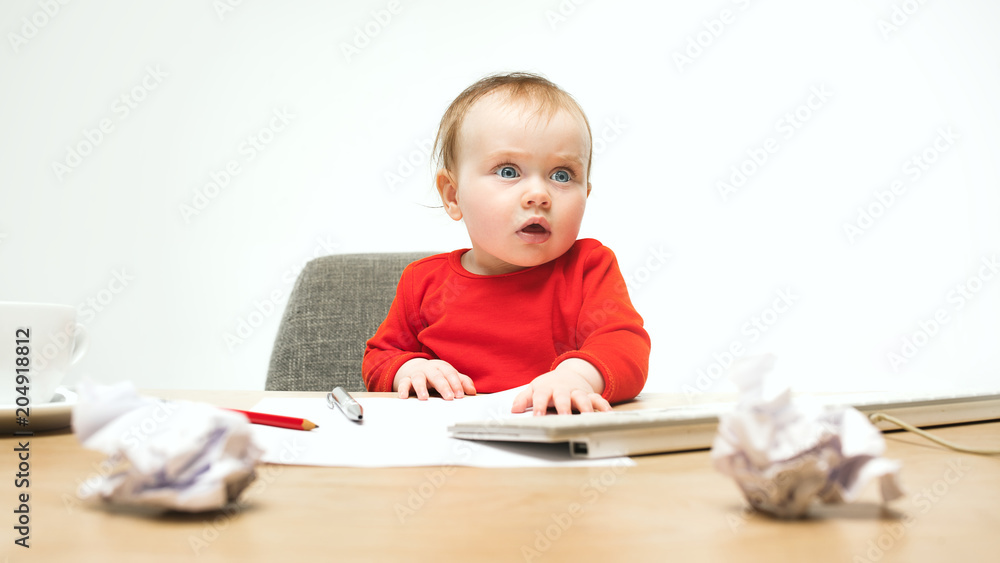Happy child baby girl toddler sitting with keyboard of computer isolated on a white background Happy child baby girl toddler sitting with keyboard of computer isolated on a white background