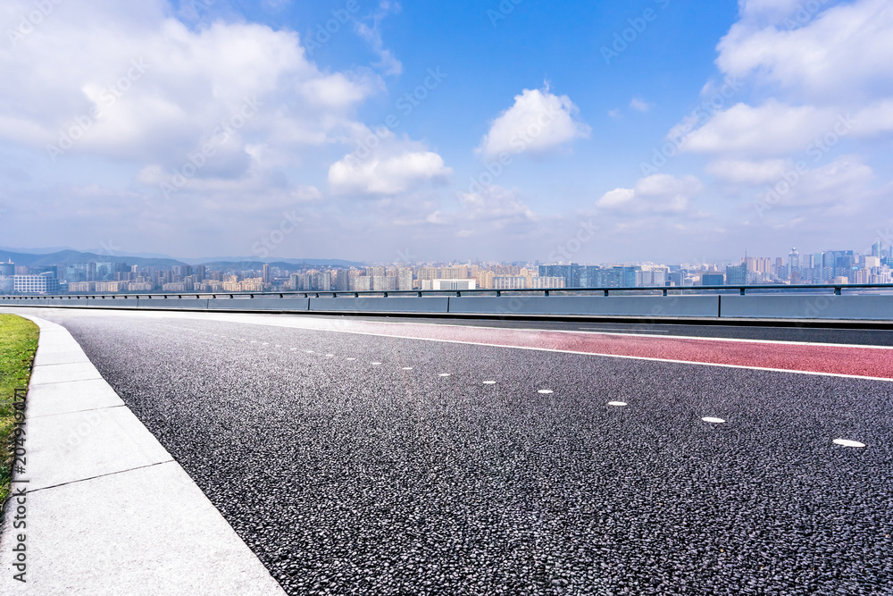Naklejka premium empty road with modern office building