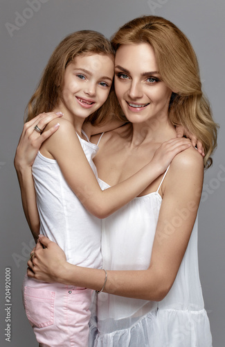 bright pictures of hugging mother and daughter