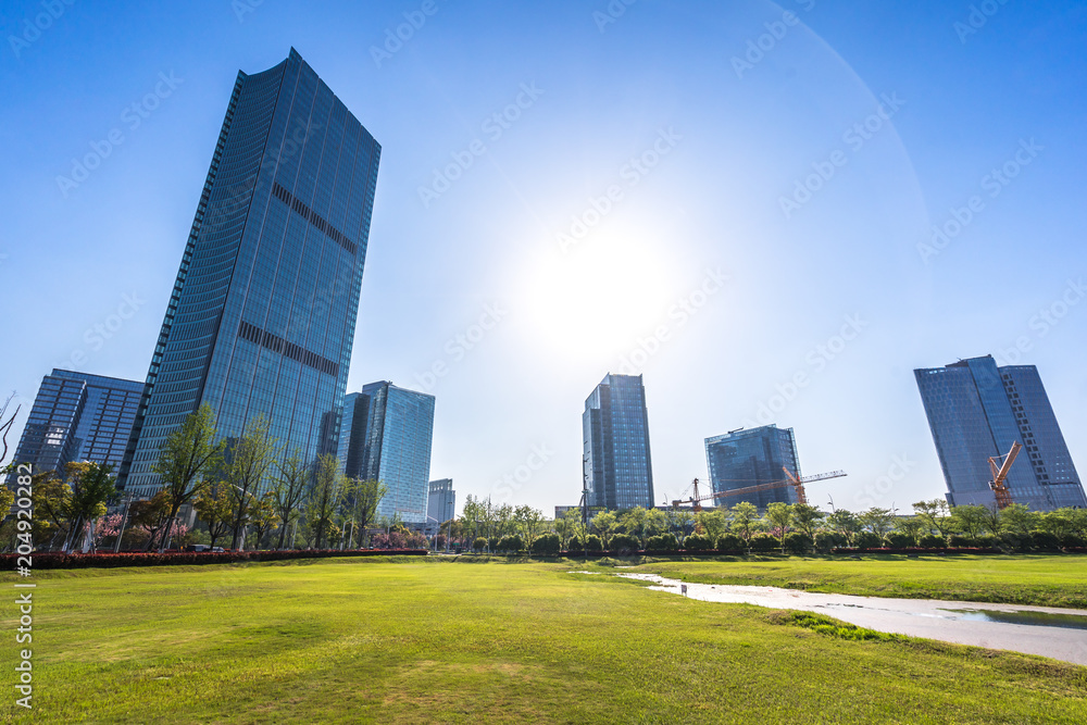 green lawn with modern office building green lawn with modern office building