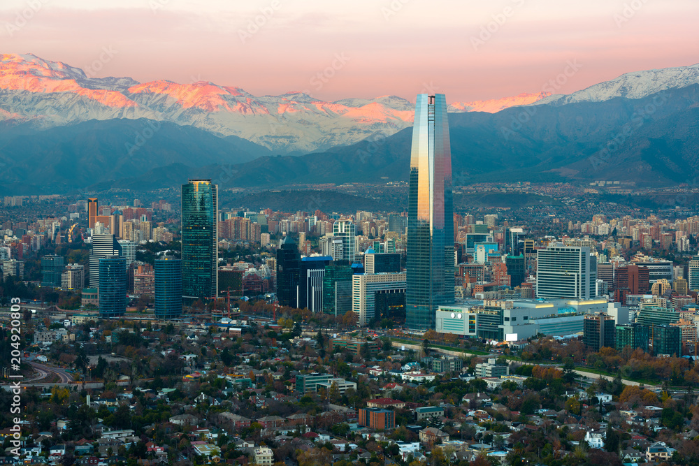 Obraz premium Panoramic view of Providencia and Las Condes districts with The Andes Mountain Range at sunset, Santiago de Chile