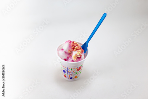 Mixed ice cream in sundae cup on white background isolate