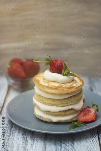 Dessert Pancakes with Cream and Strawbery. Health Breakfast Fruit Berry Vitamine Gray Rustic Wooden Background