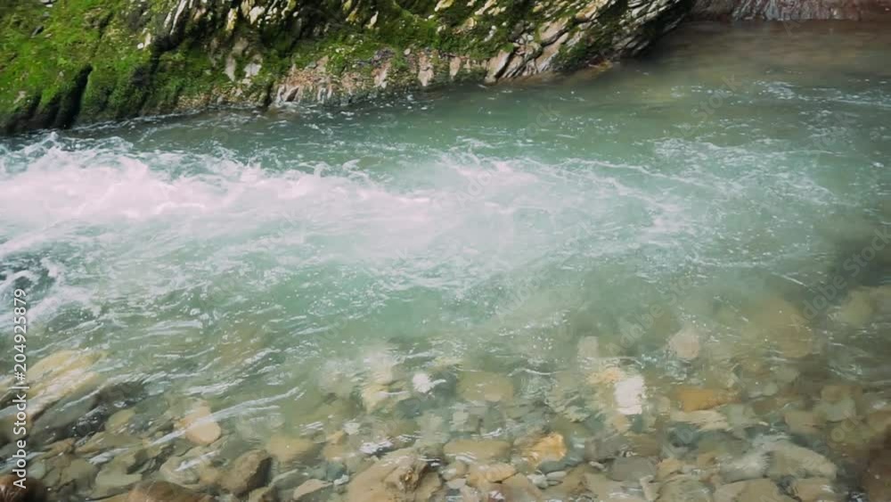 The river flowing into the canyon The river flowing into the canyon