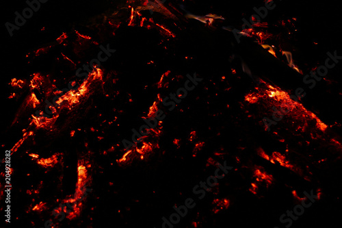 Smoldering coals on a black background
